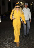 Gigi Hadid stands out in bright yellow jumpsuit as she arrives back to her apartment in New York City
