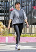 Minka Kelly dons an oversized grey t-shirt and black leggings while enjoying a stroll with a friend in Los Feliz, California