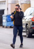 Olivia Wilde sports a black hoodie and navy leggings as she leaves the gym after a workout session in Studio City, California