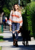 Paris Jackson dons a sweater and skinny jeans while out for a walk with her dog in West Hollywood, California