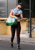 Olivia Wilde displays her toned physique in a burgundy sports bra and  leggings while leaving her workout in Studio City, California