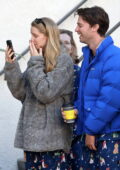 Abby Champion shows off her new engagement ring while FaceTiming during a morning stroll with fiancé Patrick Schwarzenegger in Los Angeles