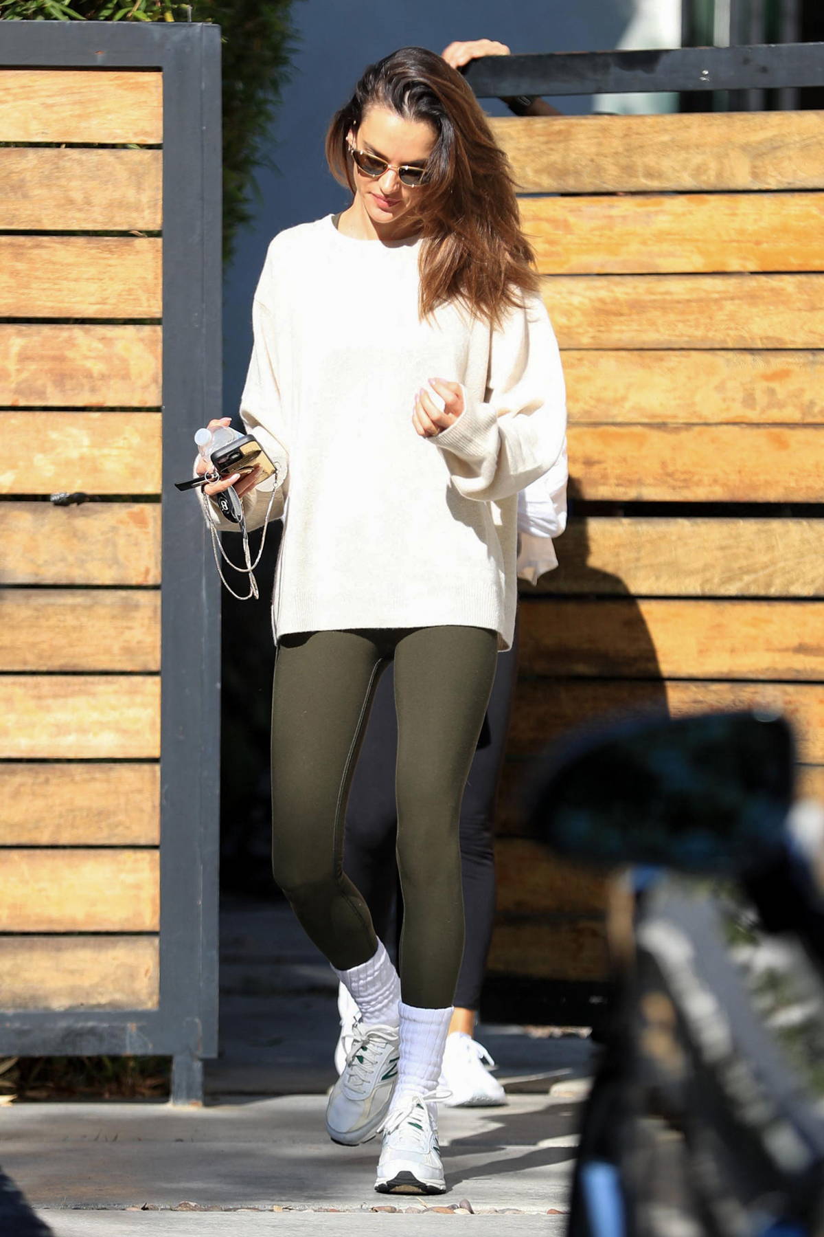 Alessandra Ambrosio keeps it sporty in beige workout top and