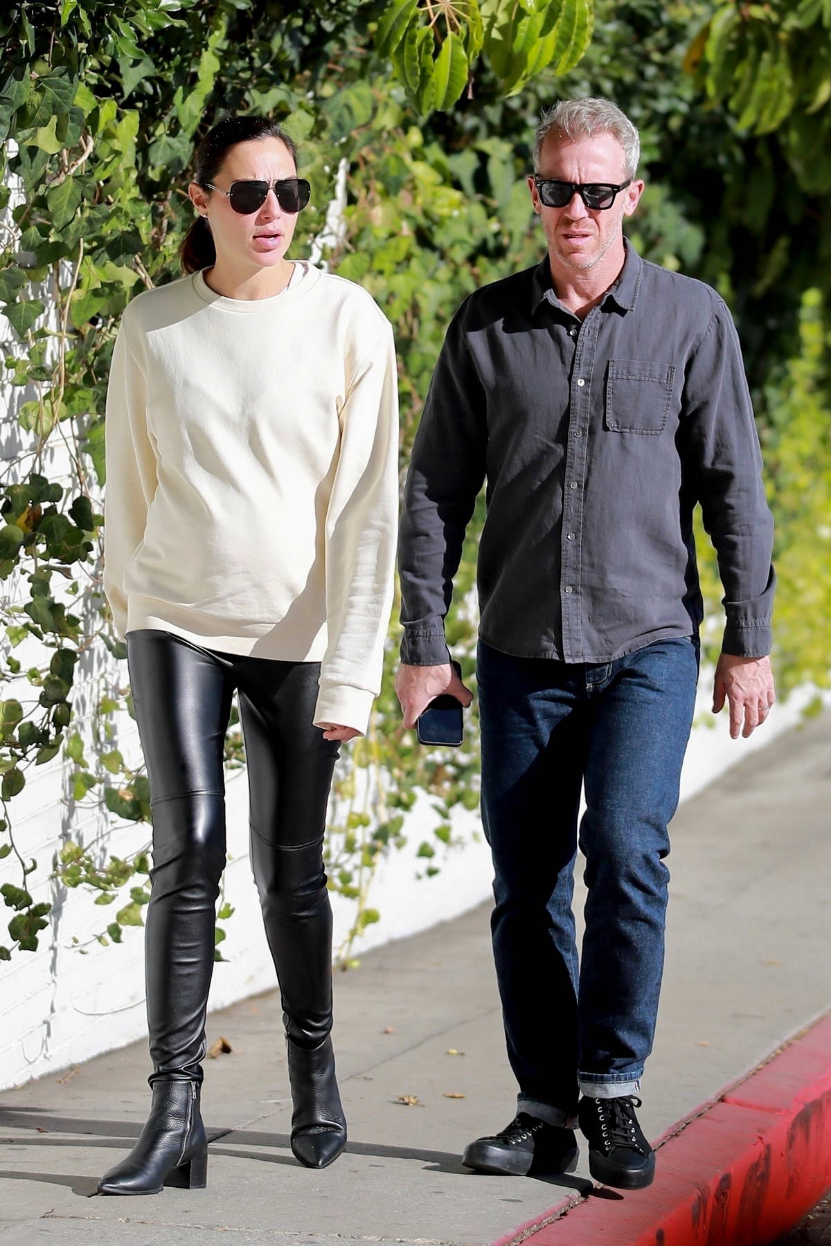 Gal Gadot dons a cream sweatshirt and black leather leggings while stepping  out with husband Yaron Varsano in Los Angeles-041223_4