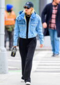 Gigi Hadid wears a denim jacket while stepping out on a solo stroll in New York City