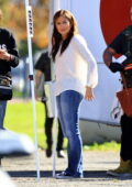 Jennifer Lopez wears a white shirt and denim while filming for 'Unstoppable at a park in Downtown, Los Angeles