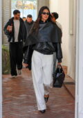 Kendall Jenner rocks a stylish leather jacket and white trousers during a shopping trip with Fai Khadra in West Hollywood, California