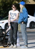 Kristen Stewart and Dylan Meyer hold hands while walking back home after enjoying lunch in Los Feliz, California