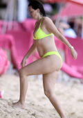 Rhea Durham seen wearing a lime green bikini as she goes for a swim with Mark Wahlberg while holidaying in Bridgetown, Barbados