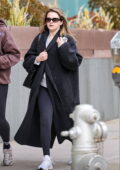 Selena Gomez wears a black overcoat, leggings and a grey top while out jewelry shopping with a friend in Beverly Hills, California
