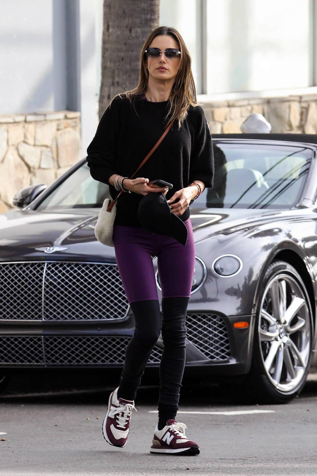 Alessandra Ambrosio rocks a black sweater with purple leggings during a  solo shopping trip to Elysewalker