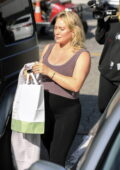 Joy Corrigan showcases her enviable figure in Alo yoga sports bra and  leggings while visiting Alo
