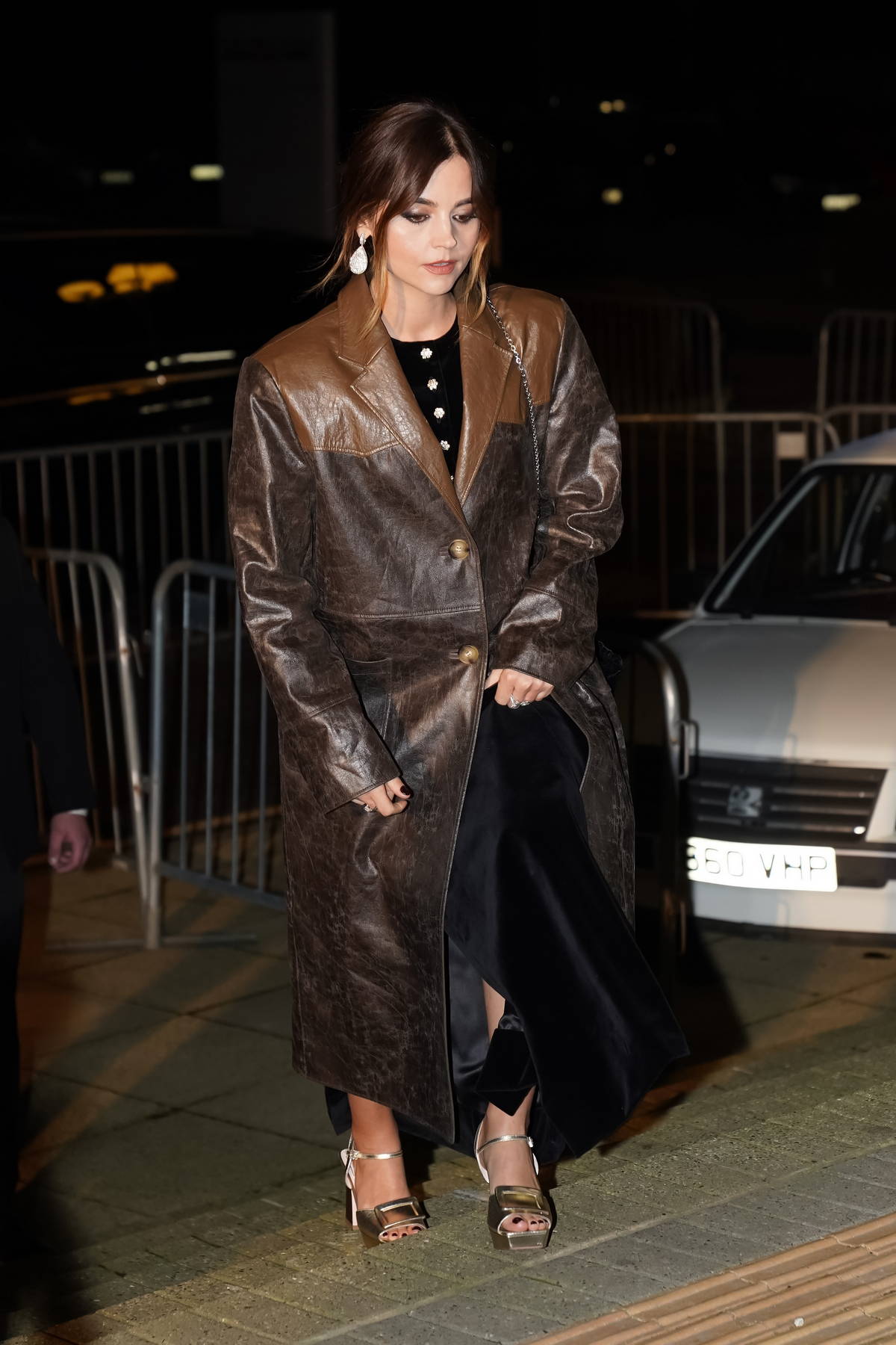 Jenna Coleman looks stylish in a brown leather coat while she picks up food to-go in Stockton-on-Tees, England