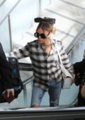 Kate Beckinsale dons a plaid shirt and ripped jeans while arriving at LAX airport in Los Angeles