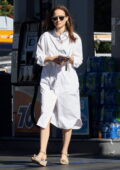 Natalie Portman looks radiant in a white shirt dress while stopping for gas in Los Feliz, California