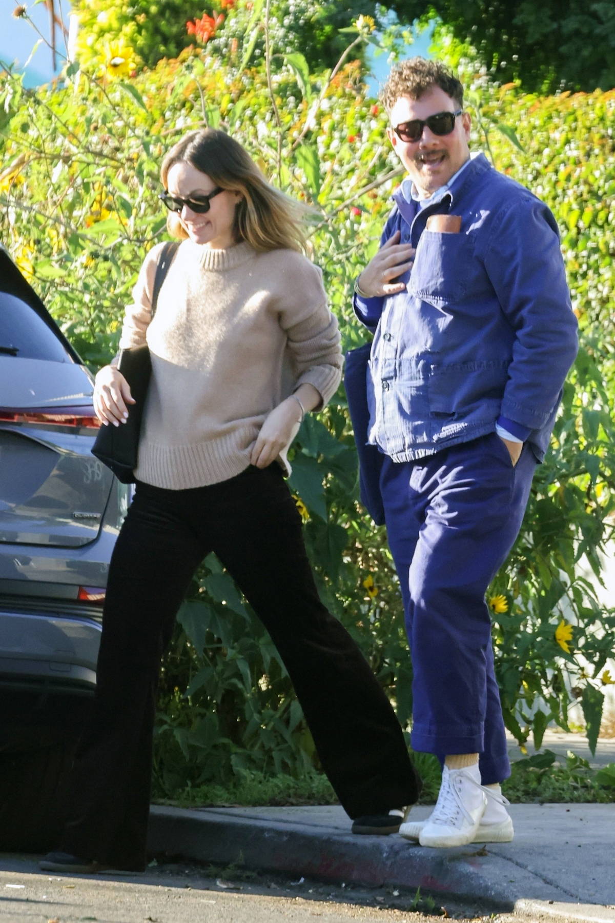 Olivia Wilde looks casually chic in a beige sweater and flared corduroy  pants while stepping out for lunch with a friend in Los Feliz,  California-110124_7