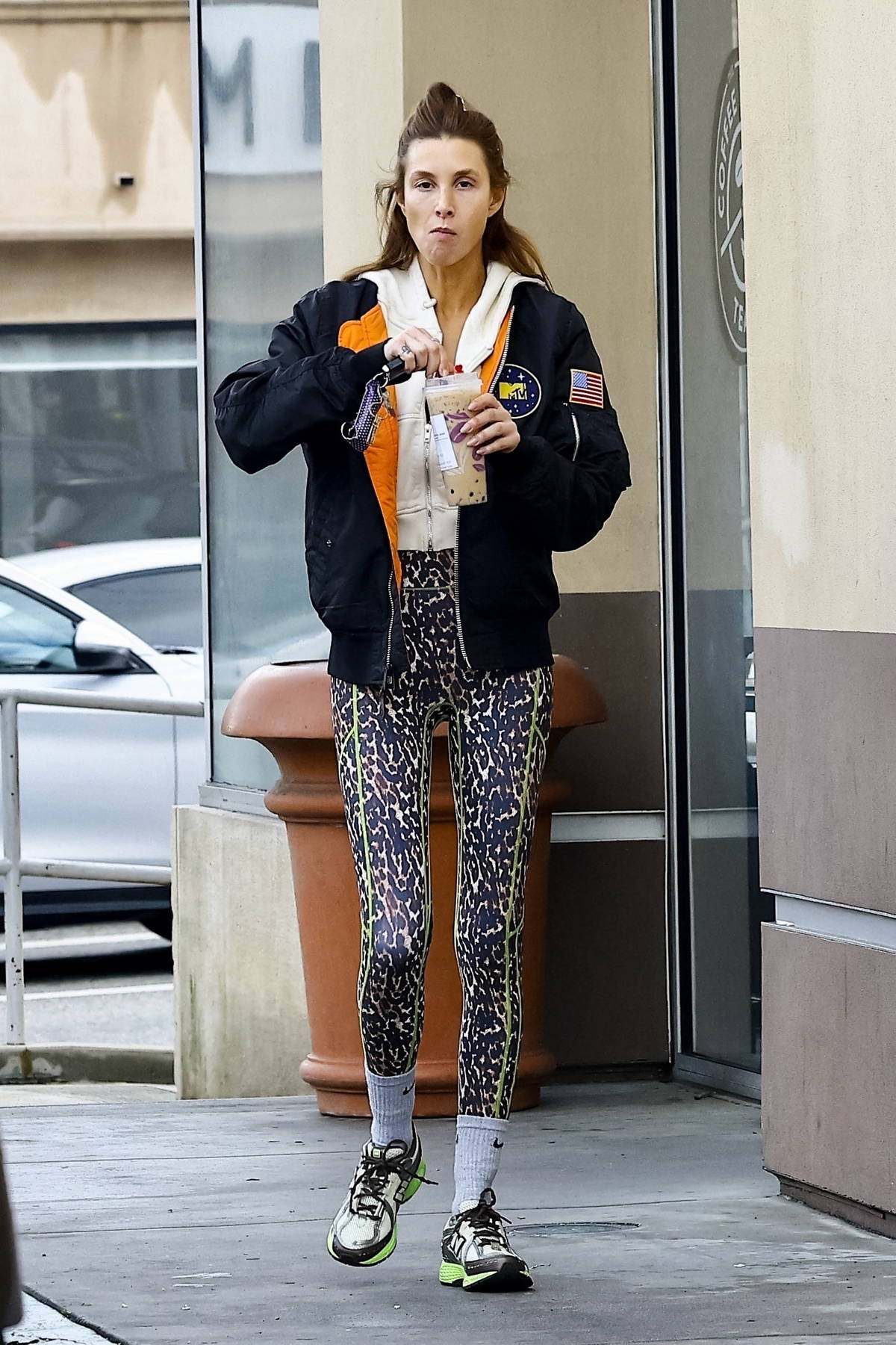 Alessandra Ambrosio rocks a black sweater with purple leggings during a solo  shopping trip to Elysewalker