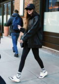 Dakota Johnson rocks a leather jacket with a hoodie and leggings while visiting a spa in New York City