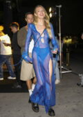 Candice Swanepoel stuns in a see-through blue dress while attending Anitta's birthday party in Miami, Florida