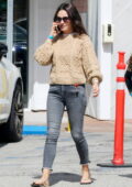 Mila Kunis wears a beige sweater and skinny jeans while out in Bel Air, California