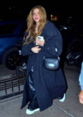 Shakira is all smiles as she bundles up in an oversized wool coat for a night out in New York City