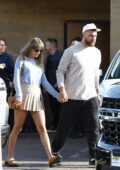 Taylor Swift and Travis Kelche hold hands as they step out for a lunch date at Nobu in Malibu, California