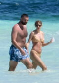 Taylor Swift stuns in a beige bikini while enjoying the beach with boyfriend Travis Kelce during a romantic getaway in the Bahamas