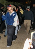 Hailey Bieber and Justin Bieber attend Doja Cat's performance during the 2024 Coachella Valley Music and Arts Festival in Indio, California