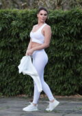 Danielle Lloyd sports a white crop top and leggings during an outdoor workout session at a local park in Birmingham, England