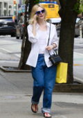 Elle Fanning looks casual yet stylish in a white shirt and blue jeans while out on a shopping trip in New York City