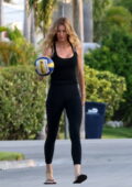 Gisele Bundchen displays her enviable figure in a black tank top and leggings while enjoying some street volleyball in Miami, Florida