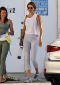 Gisele Bundchen shows off her svelte figure in a white tank top and grey leggings while she leaves the gym in Miami, Florida