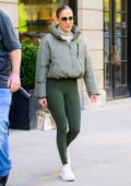 Jennifer Lopez rocks a puffy jacket and green leggings while exiting her apartment in New York City