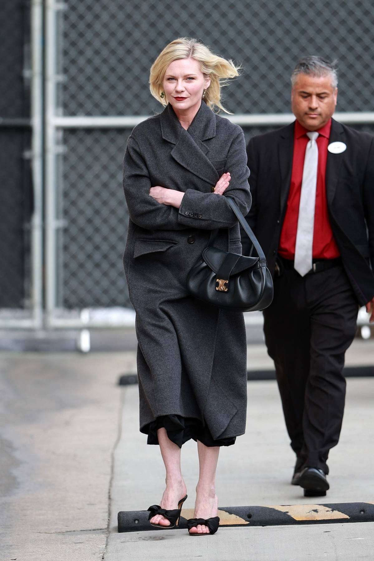 Kirsten Dunst bundles up in a grey overcoat while arriving for an appearance on 'Jimmy Kimmel Live!' in Los Angeles