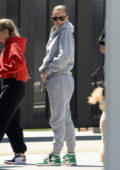 Lala Kent covers her baby bump in an oversized grey hoodie while visiting Culver Studios in Culver City, California