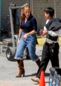 Margot Robbie seen wearing a navy top, jeans and suede boots while filming 'A Big Bold Beautiful Journey' in Los Angeles