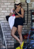 Rita Ora displays her fit physique in a black sports bra and spandex shorts while out for a yoga class in Sydney, Australia