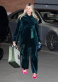 Sofia Richie shows her growing baby bump in a green velvet ensemble while exiting the NB44 party in Beverly Hills, California