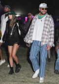 Taylor Swift and Travis Kelce hold hands as they enjoy the 2024 Coachella Music and Arts Festival in Indio, California