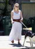 Ava Phillippe looks radiant in a white dress while walking her dog in Los Angeles