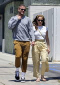 Minka Kelly and boyfriend Dan Reynolds hold hands while stepping out for coffee in Los Angeles