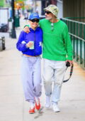 Rita Ora and Taika Waititi put on a colorful display while stepping out for a morning stroll in New York City