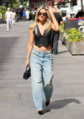 Ashley Roberts flashes her toned midriff in a leather waistcoat and low-rise jeans while stepping out in London, England