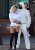 Bianca Censori puts on a cheeky display in a white bodysuit as she touches down at Florence airport with Kanye West in Italy