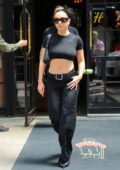 Charli XCX flaunts her midriff in a black crop top while exiting The Bowery Hotel in New York City