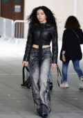 Charli XCX rocks a biker jacket and denim while seen leaving BBC Radio Studios in London, England