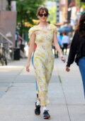 Dakota Johnson looks beautiful in a yellow floral print dress while filming scenes with Chris Evans on the set of 'Materialists' in New York City