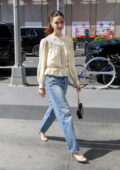 Ella Hunt looks radiant in an ivory top and jeans while out in New York City