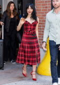 Jenna Ortega is all smiles while stepping out wearing a red and black plaid dress with matching blazer and heels in New York City