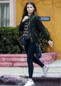 Kate Mara wears a green jacket, striped top and black leggings while out for lunch in Los Angeles